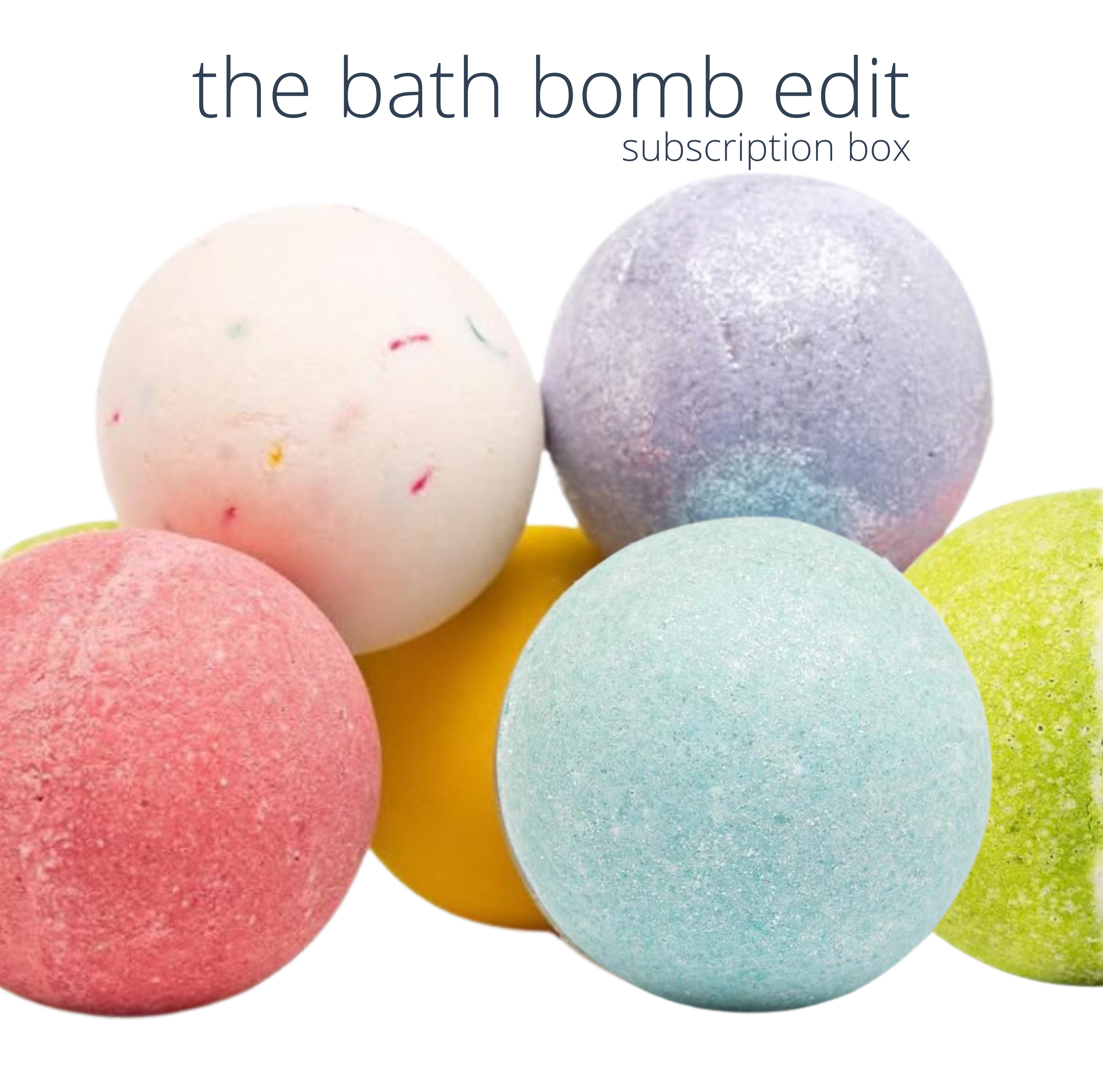 An assortment of colorful bath bombs from the Bath Bomb Edit subscription box, featuring a variety of colors and textures by 'living the good life naturally'