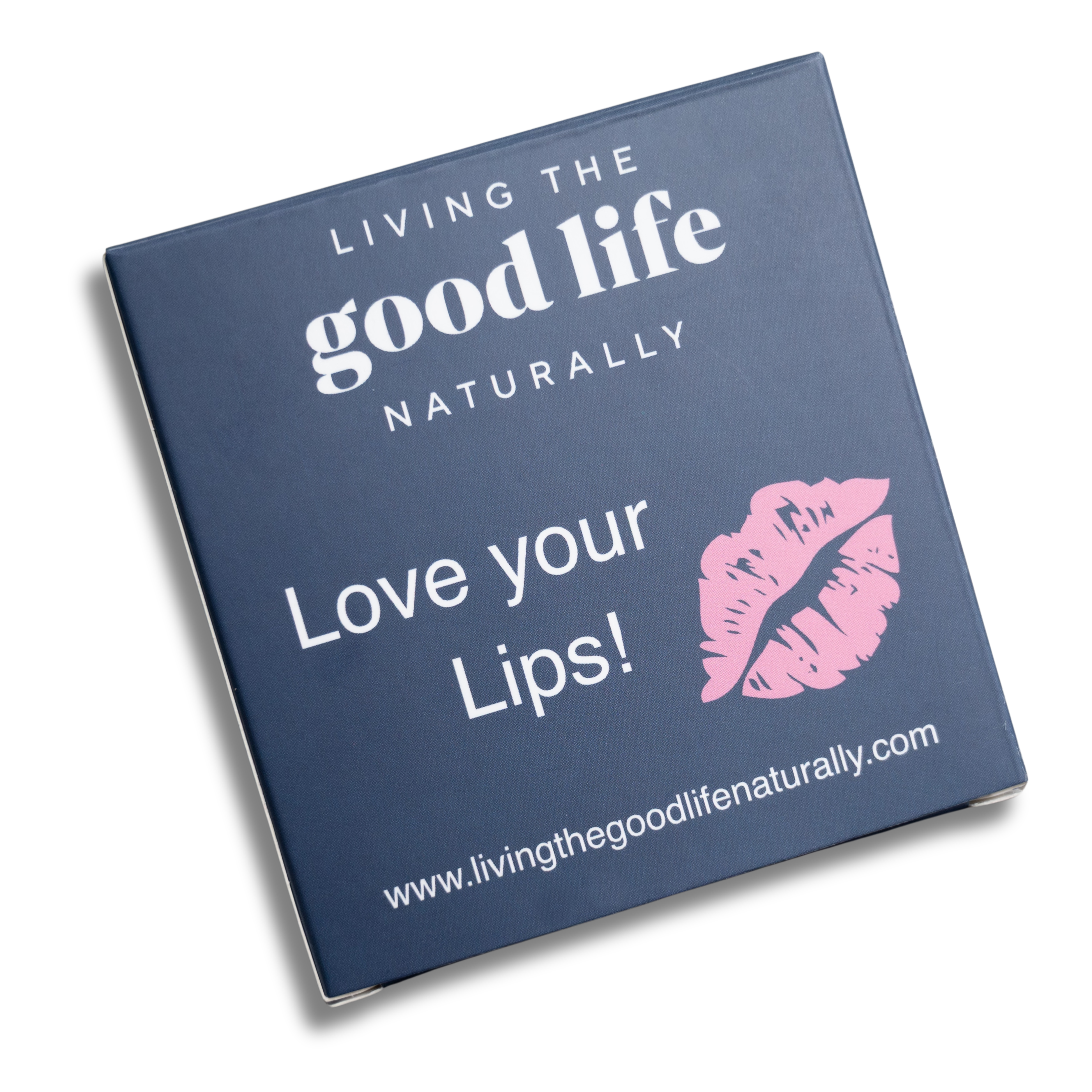 A rectangular box with a navy background, featuring the text 'Living the Good Life Naturally' and 'LOVE YOUR LIPS!' along with the website address 'www.livingthegoodlifenaturally.