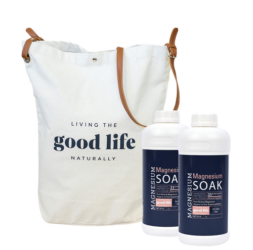 Two bottles of Magnesium Soak for Stress & Anxiety Relief next to a white tote bag with text 'LIVING THE GOOD LIFE NATURALLY'.