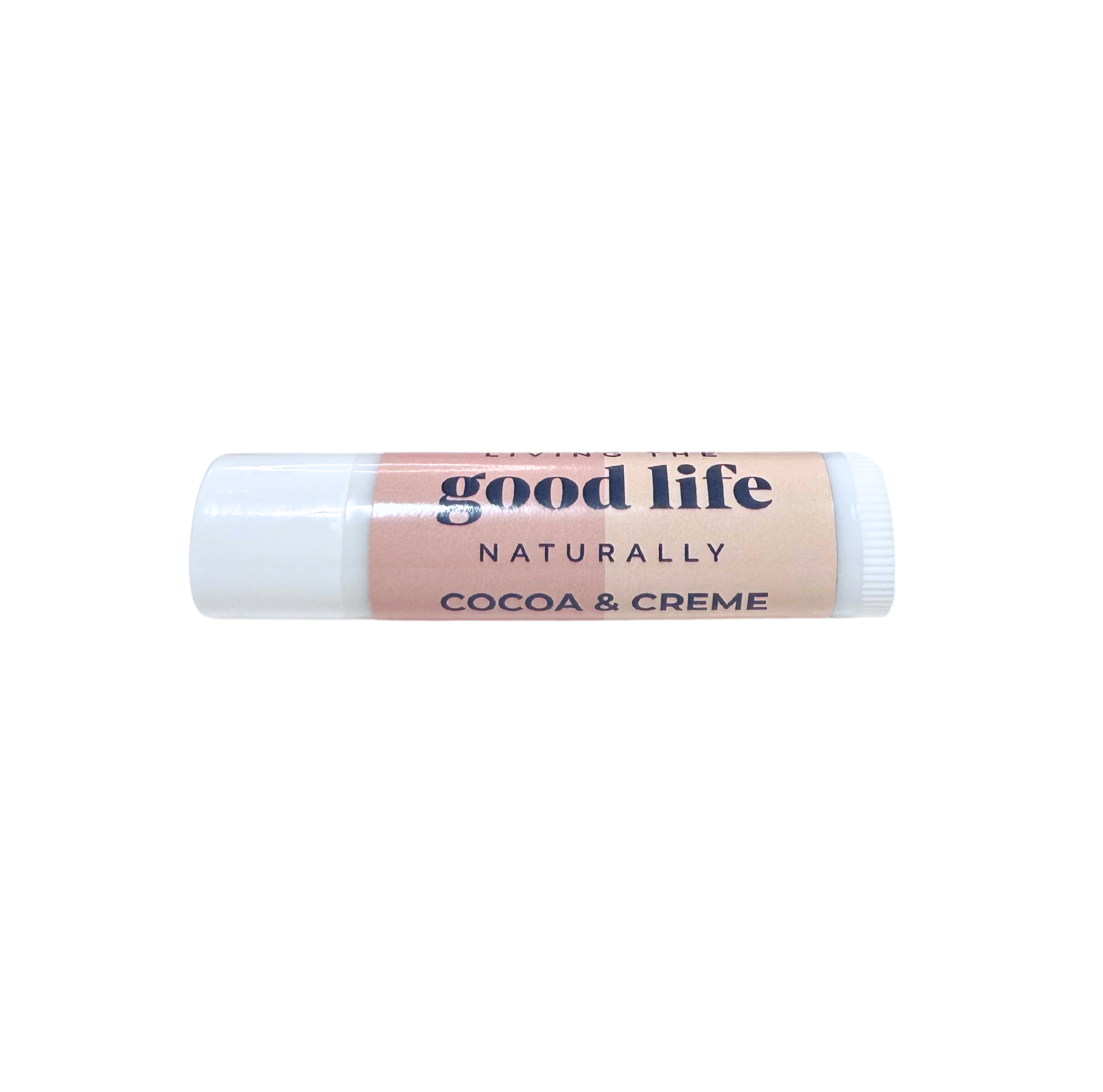 White chapstick tube with peach and pink label that reads Good Life Naturally Cocoa & Creme 