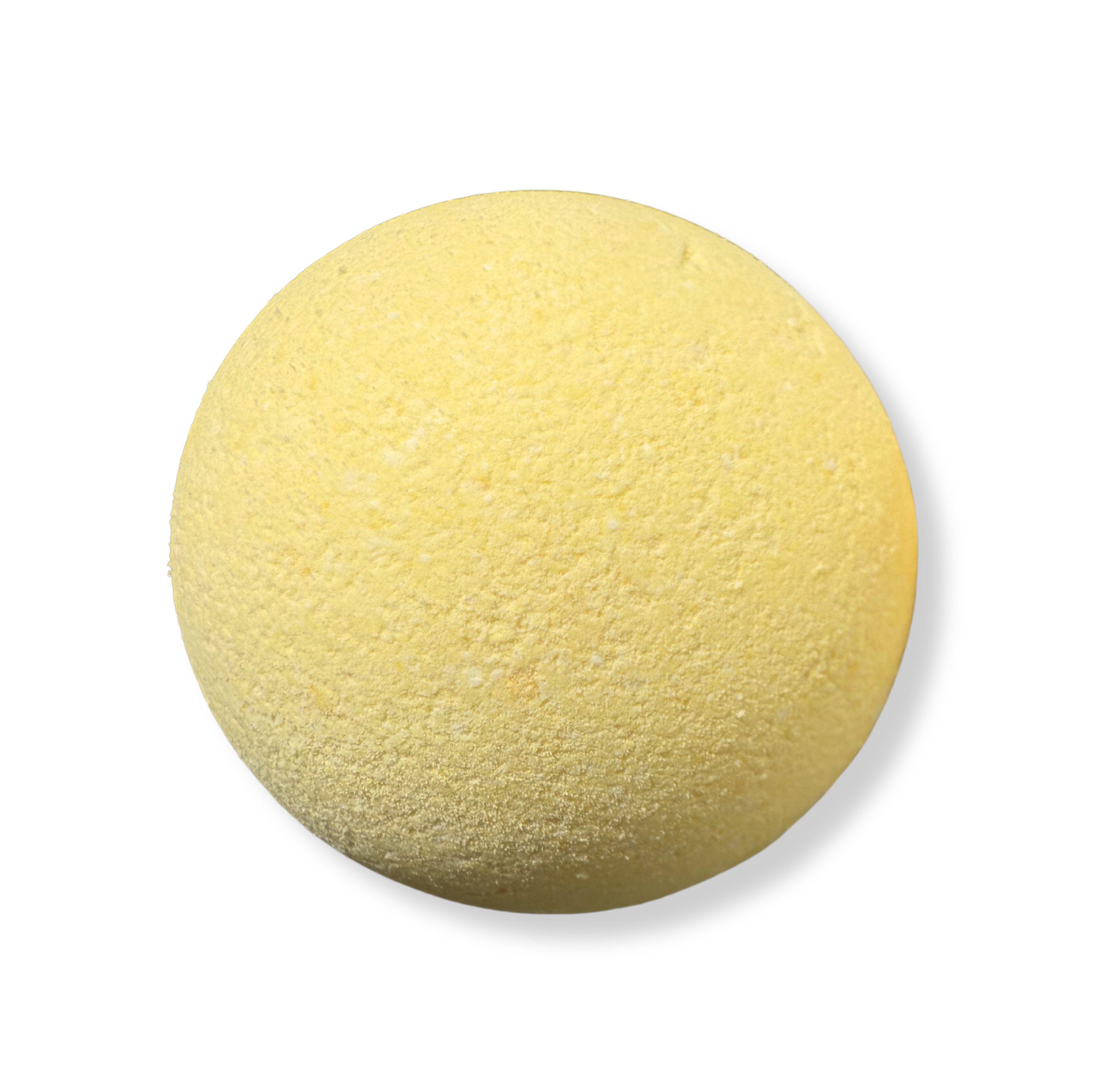 A yellow bath bomb by living the good life naturally with a textured surface on a white background, representing the product's physical appearance.