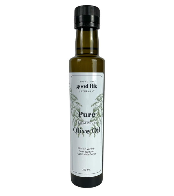 A dark green narrow bottle with a white label. The label reads, "Living the Good Life Naturally, Pure Extra Virgin Olive Oil, Mission Variety, Permaculture, Sustainably Grown, 250mL."